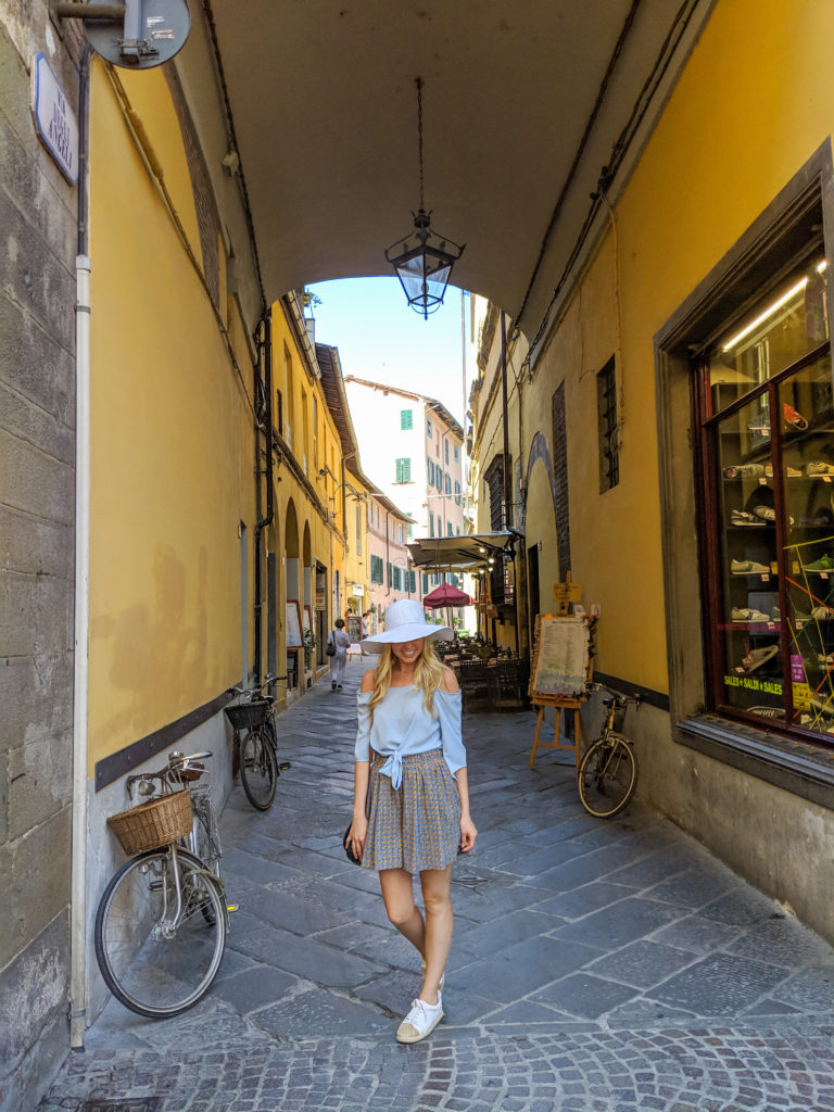 Woman walking in Lucca Italy 