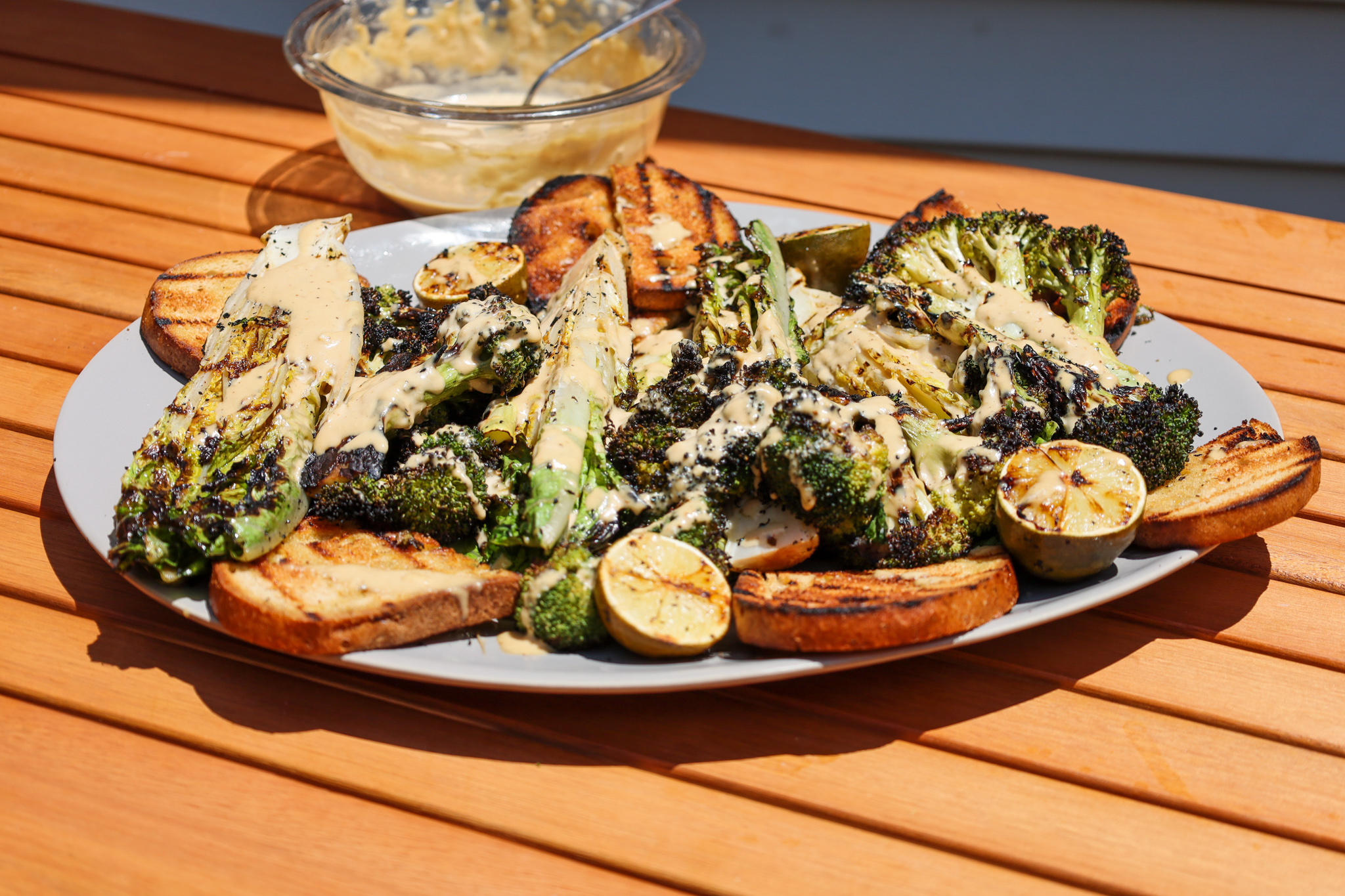 Grilled Romaine and Broccoli Tahini Caesar salad