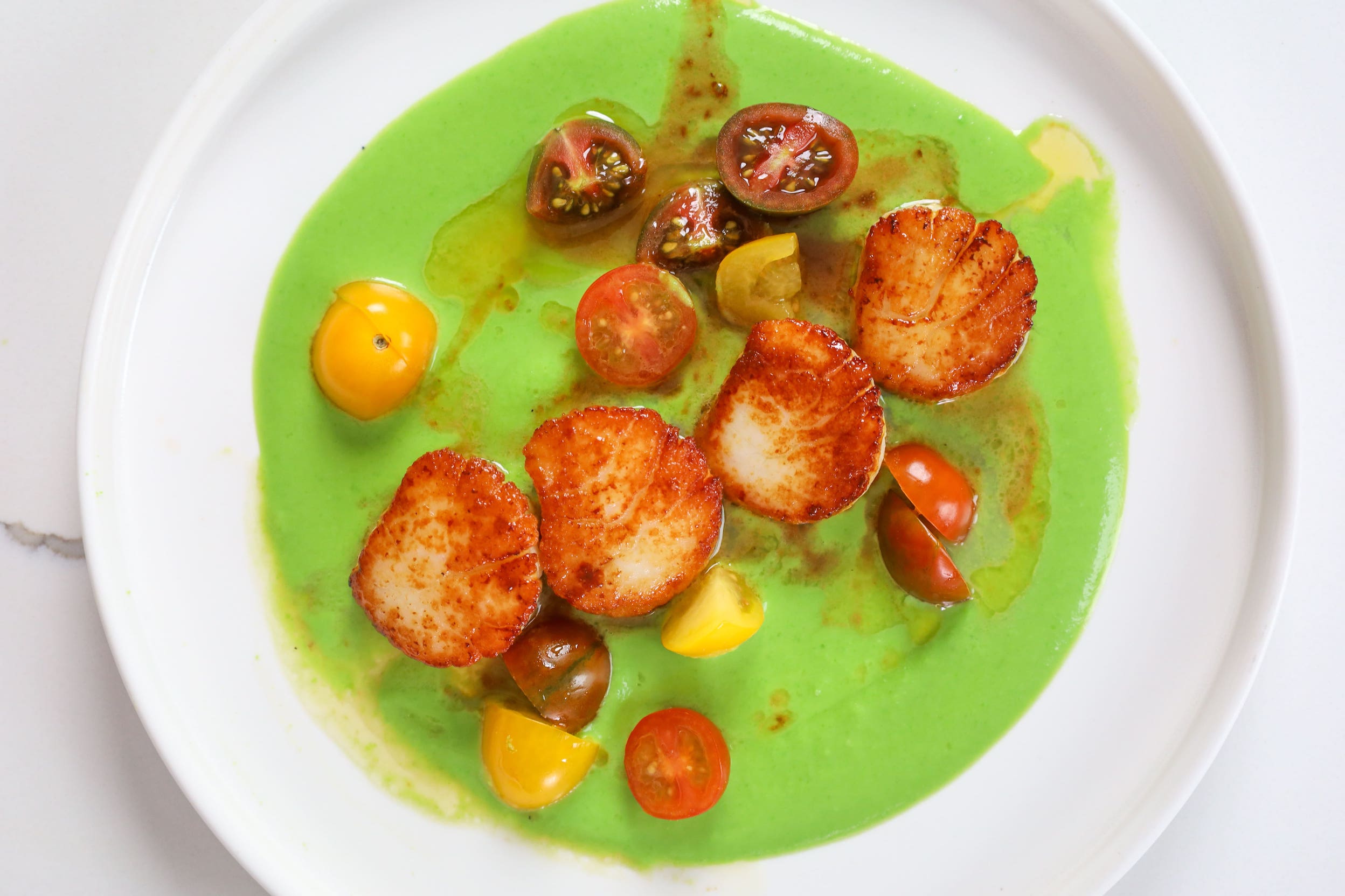 Seared Scallops with Sweet Pea Purée and Cherry Tomatoes