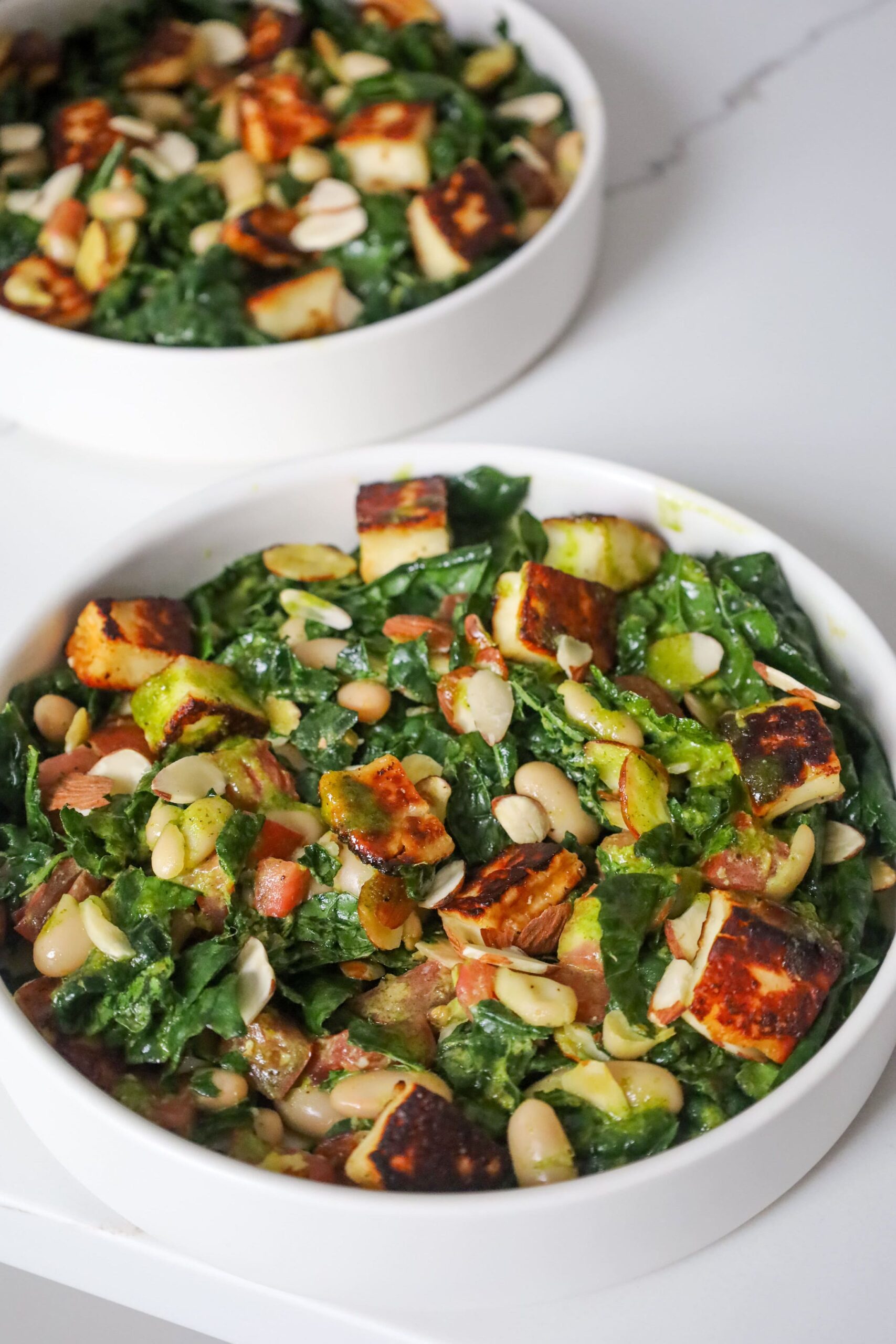 tuscan kale salad with white beans tomato and halloumi