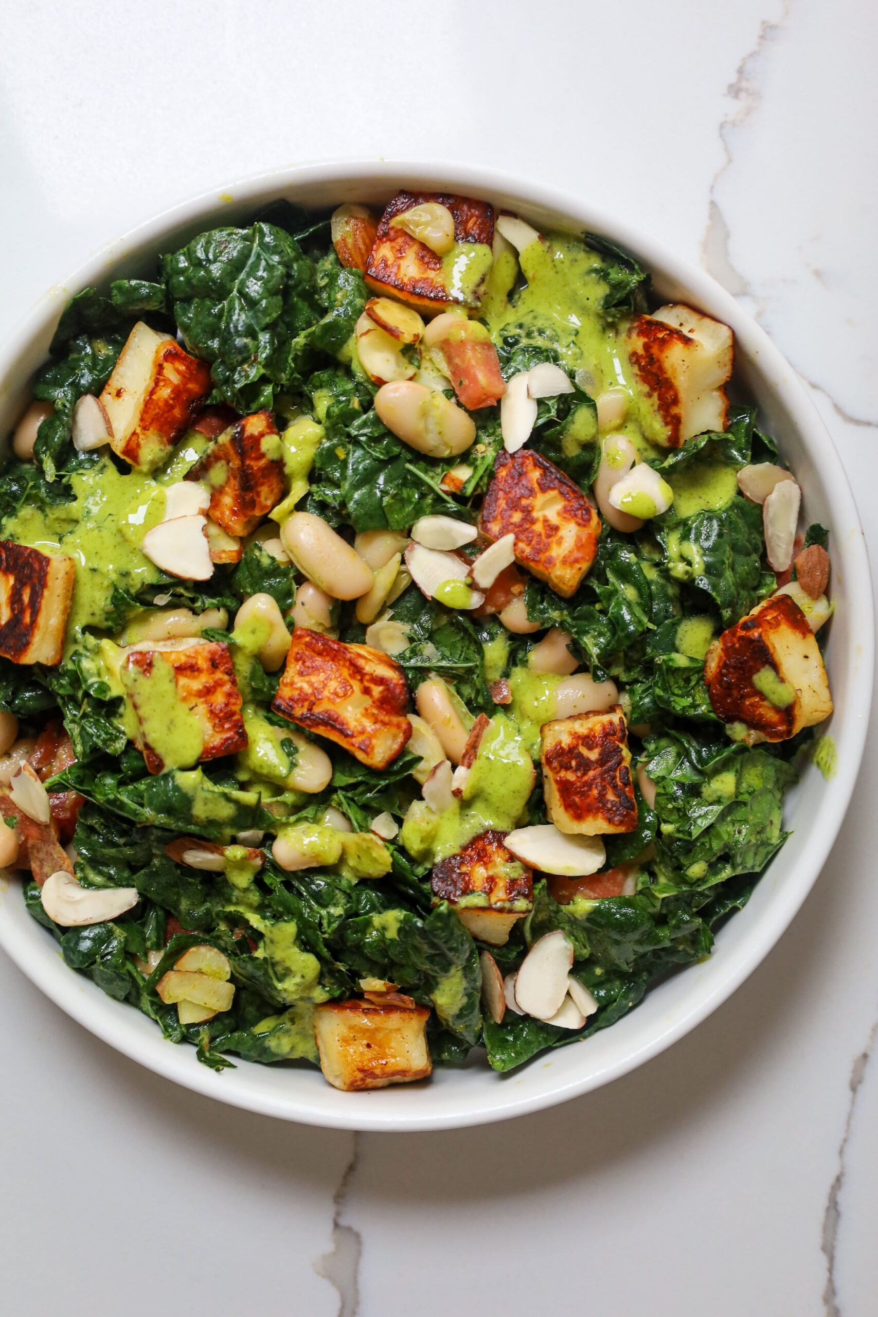 tuscan kale salad with white beans tomato and halloumi